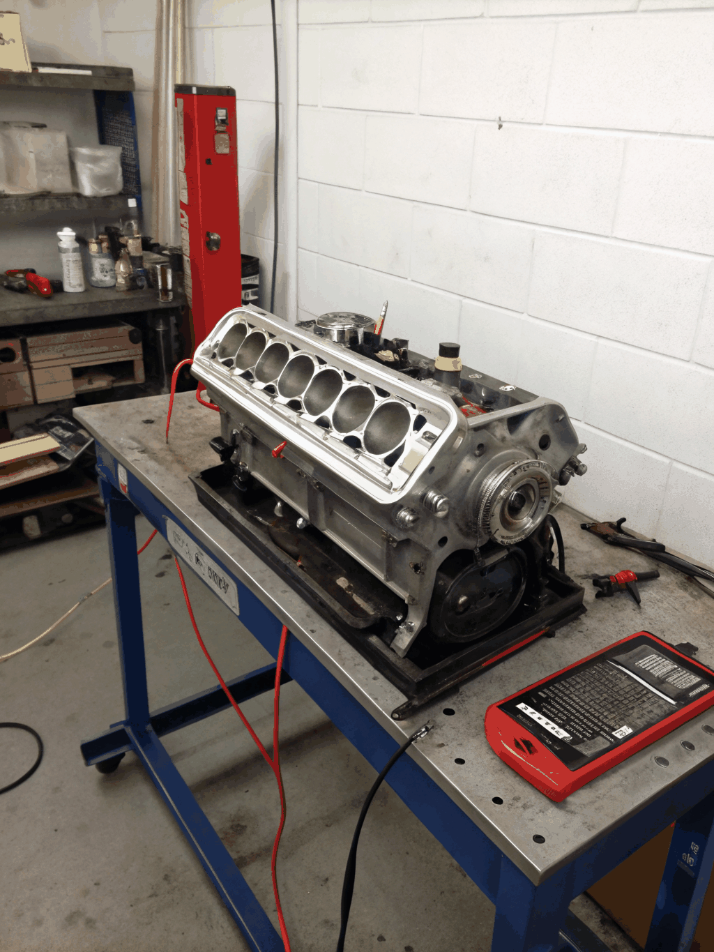 Technical diagnostics being performed on a luxury vehicle engine